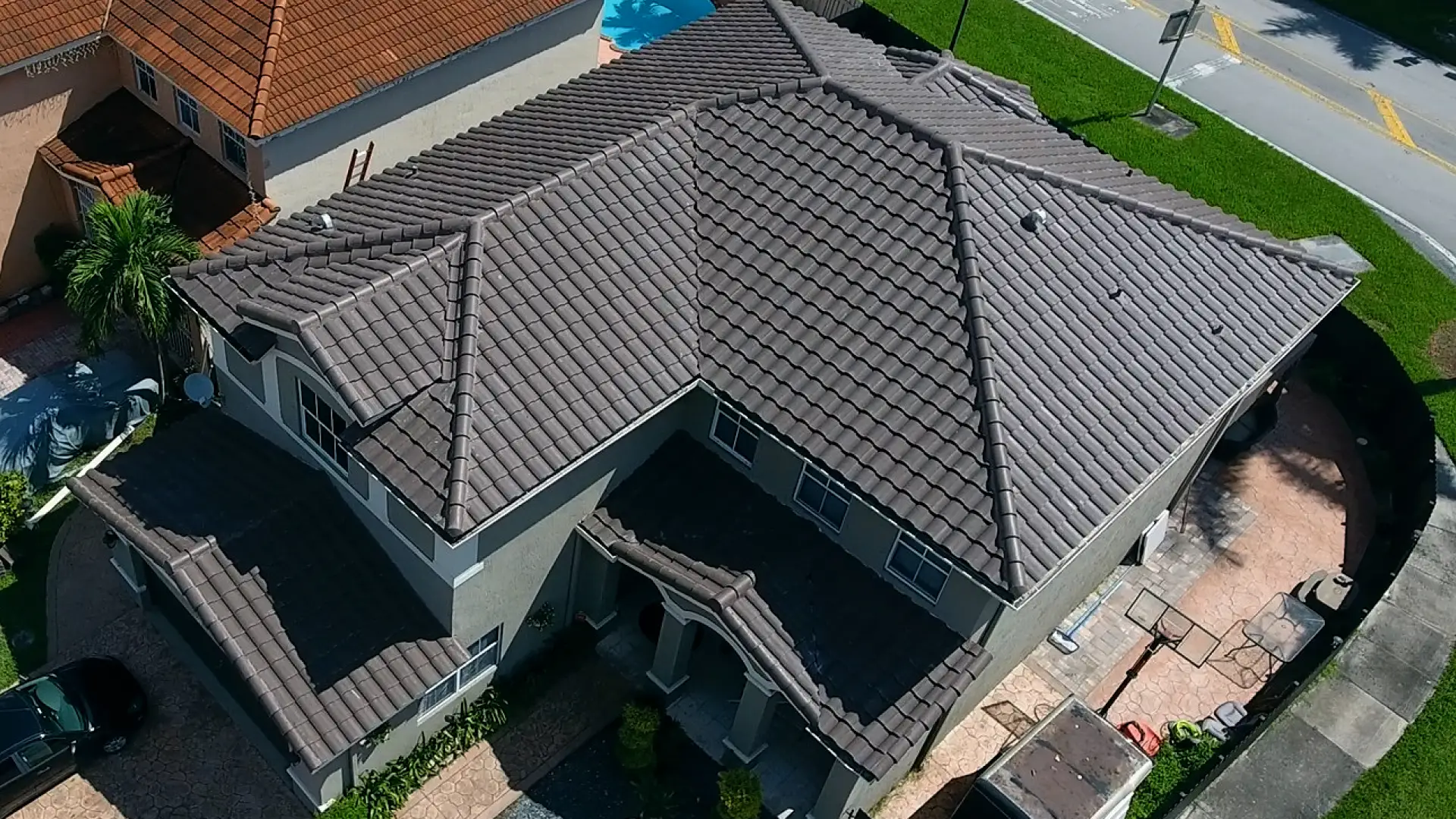 aerial photo of a houses new tile roof after reroofing service miami gardens fl