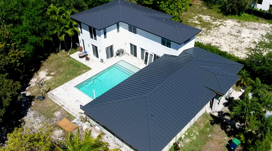 aerial picture of a houses new metal roof after reroofing service miami gardens fl